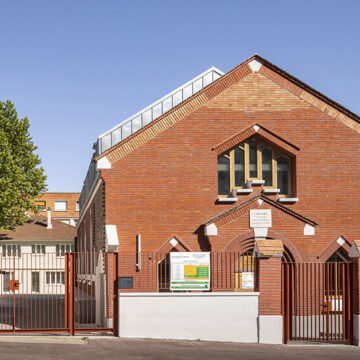 Transforming Tradition: The Evolution of a Chapel into Thrift Shop and Social Housing by Tectône