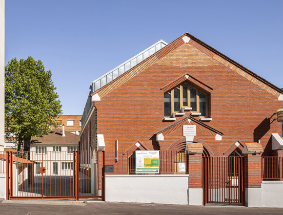 Transforming Tradition: The Evolution of a Chapel into Thrift Shop and Social Housing by Tectône